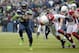 Dec 9, 2012; Seattle, WA, USA; Seattle Seahawks running back Marshawn Lynch (24) is pursued by Arizona Cardinals linebackers Quentin Groves (54) and Stewart Bradley (55) at CenturyLink Field. Mandatory Credit: Kirby Lee/Image of Sport-USA TODAY Sports