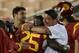 LOS ANGELES, CA - OCTOBER 10: Interim head coach Ed Orgeron and running back Silas Redd #25 of the USC Trojans embrace at the end of the game with the Arizona Wildcats at Los Angeles Coliseum on October 10, 2013 in Los Angeles, California. USC won 38-31. (Photo by Stephen Dunn/Getty Images)