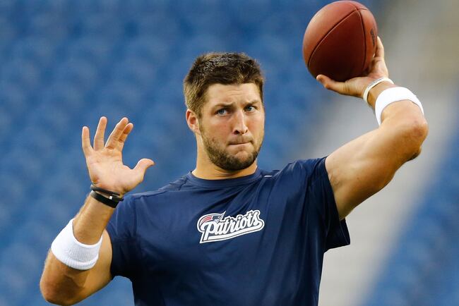 Hi-res-178346622-tim-tebow-of-the-new-england-patriots-warms-up-prior-to_crop_north