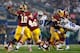 ARLINGTON, TX - OCTOBER 13: Robert Griffin III #10 of the Washington Redskins looks for an open receiver against the Dallas Cowboys in the second quarter on October 13, 2013 in Arlington, Texas. (Photo by Tom Pennington/Getty Images)