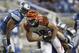 DETROIT - AUGUST 12: Chase Cofman #80 of the Cincinnati Bengals runs for a short gain in the second quarter as Bobby Carpenter #59 of the Detroit Lions makes the stop during the game at Ford Field on August 12, 2011 in Detroit, Michigan. (Photo by Leon Halip/Getty Images)