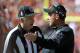 Oct 13, 2013; Kansas City, MO, USA; Oakland Raiders head coach Dennis Allen (right) talks to field judge Mike Weir (50) against the Kansas City Chiefs in the second half at Arrowhead Stadium. Kansas City won the game 24-7. Mandatory Credit: John Rieger-USA TODAY Sports