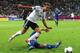 GDANSK, POLAND - JUNE 22: Mario Gotze of Germany rides tackle during the UEFA EURO 2012 quarter final match between Germany and Greece at The Municipal Stadium on June 22, 2012 in Gdansk, Poland. (Photo by Alex Grimm/Getty Images)