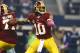 ARLINGTON, TX - OCTOBER 13: Robert Griffin III #10 of the Washington Redskins throws a pass in the first quarter of a game against the Dallas Cowboys on at AT&T Stadium October 13, 2013 in Arlington, Texas. (Photo by Tom Pennington/Getty Images)