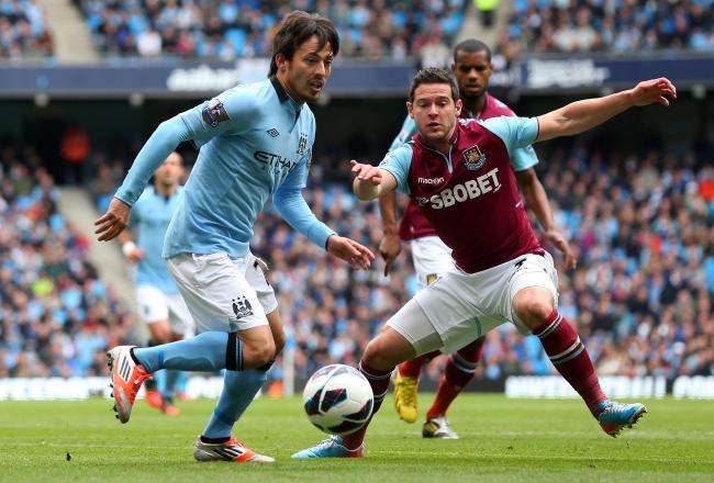 Hi-res-167651005-david-silva-of-manchester-city-beats-matt-jarvis-of_crop_north