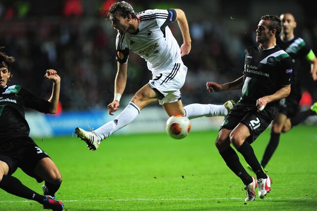 Hi-res-183001276-swansea-player-michu-has-a-shot-blocked-during-the-uefa_crop_north