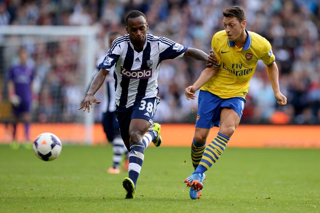 Hi-res-183436291-mesut-oezil-of-arsenal-battles-with-saido-berahino-of_crop_north
