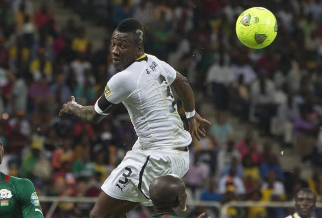 Hi-res-160845186-asamoah-gyan-from-ghana-during-the-2013-orange-african_crop_north