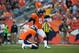 DENVER, CO - SEPTEMBER 29: Kicker Matt Prater #5 of the Denver Broncos attempts a point after kick as Britton Colquitt #4 holds the ball against the Philadelphia Eagles at Sports Authority Field Field at Mile High on September 29, 2013 in Denver, Colorado. (Photo by Dustin Bradford/Getty Images)