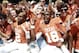 Oct 12, 2013; Dallas, TX, USA; Texas Longhorns wide receiver Kendall Sanders (2) and quarterback Tyrone Swoopes (18) celebrate with fans after beating Oklahoma Sooners in the Red River Rivalry at Cotton Bowl Stadium. The Texas Longhorns beat the Oklahoma Sooners 36-20. Mandatory Credit: Tim Heitman-USA TODAY Sports