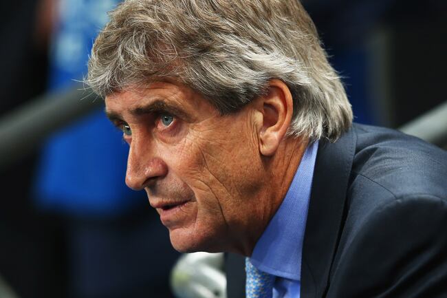 Hi-res-182829583-manuel-pellegrini-coach-of-manchester-city-looks-on_crop_north