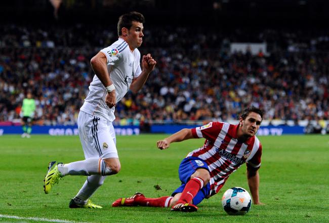 Hi-res-182172911-gareth-bale-of-real-madrid-duels-for-the-ball-with-koke_crop_north