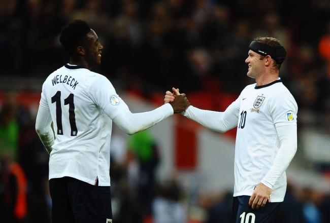 Hi-res-184702566-wayne-rooney-of-england-shakes-hands-with-team-mate_crop_north
