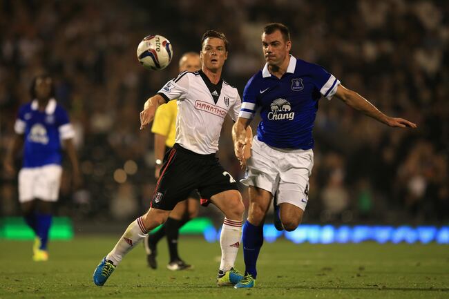 Hi-res-181745234-scott-parker-of-fulham-challenges-darron-gibson-of_crop_north