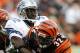 CINCINNATI, OH - DECEMBER 6: Cedric Benson #32 of the Cincinnati Bengals breaks free from Anthony Henry #32 of the Detroit Lions in their NFL game at Paul Brown Stadium December 6, 2009 in Cincinnati, Ohio. (Photo by John Sommers II/Getty Images)
