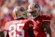 SAN FRANCISCO, CA - OCTOBER 13: Colin Kaepernick #7 congratulates Vernon Davis #85 of the San Francisco 49ers after he scored a touchdown at Candlestick Park on October 13, 2013 in San Francisco, California. (Photo by Ezra Shaw/Getty Images)