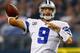 ARLINGTON, TX - OCTOBER 13: Tony Romo #9 of the Dallas Cowboys looks for an open receiver against the Washington Redskins in the third quarter on October 13, 2013 in Arlington, Texas. The Cowboys beat the Redskins 31-16. (Photo by Tom Pennington/Getty Images)
