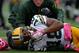 BALTIMORE, MD - OCTOBER 13: Randall Cobb #18 of the Green Bay Packers is attended to by a trainer after being injuired on a play in the second quarter during a game against the Baltimore Ravens at M&T Bank Stadium on October 13, 2013 in Baltimore, Maryland. (Photo by Patrick McDermott/Getty Images)