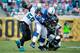 JACKSONVILLE, FL - SEPTEMBER 29: Geno Hayes #55 of the Jacksonville Jaguars attempts to tackle Trent Richardson #34 of the Indianapolis Colts during the game at EverBank Field on September 29, 2013 in Jacksonville, Florida. (Photo by Sam Greenwood/Getty Images)