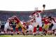 Palmer looks to complete a pass against the 49ers.