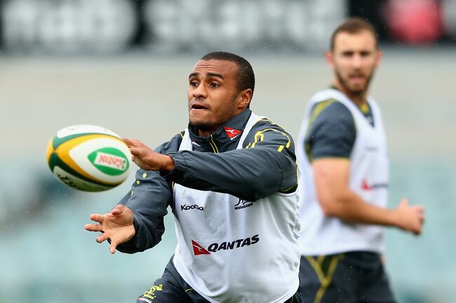Hi-res-180450468-will-genia-of-the-wallabies-passes-during-an-australian_crop_north