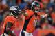 DENVER, CO - OCTOBER 13: Quarterback Peyton Manning #18 of the Denver Broncos directs the offense against the Jacksonville Jaguars at Sports Authority Field at Mile High on October 13, 2013 in Denver, Colorado. The Broncos defeated the Jaguars 35-19. (Photo by Doug Pensinger/Getty Images)