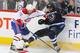 WINNIPEG, MB - OCTOBER 15: Francis Bouillon #55 of the Montreal Canadiens checks Blake Wheeler #26 of the Winnipeg Jets along the boards during second period action at the MTS Centre on October 15, 2013 in Winnipeg, Manitoba, Canada. (Photo by Jonathan Kozub/NHLI via Getty Images)