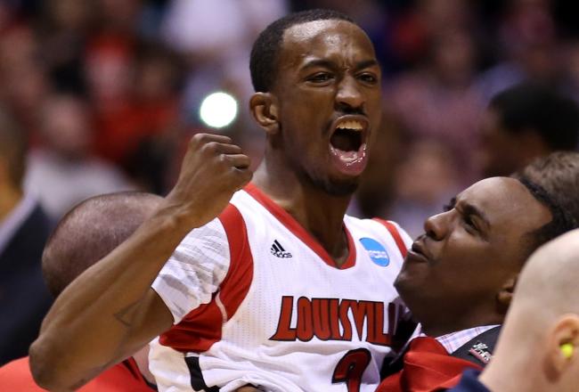 Hi-res-165128269-russ-smith-of-the-louisville-cardinals-is-held-up-by_crop_north