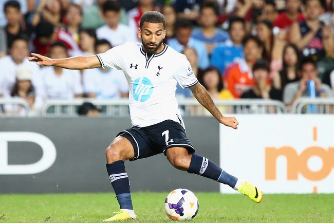 Hi-res-174549679-aaron-lennon-of-tottenhan-hotspur-kicks-the-ball-during_crop_north