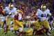 LOS ANGELES, CA - NOVEMBER 24: Curtis McNeal #22 of the USC Trojans rushes as he is chased by Sheldon Day #91 of the Notre Dame Fighting Irish during a 22-13 Notre Dame win at Los Angeles Memorial Coliseum on November 24, 2012 in Los Angeles, California. (Photo by Harry How/Getty Images)