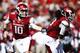 FAYETTEVILLE, AR - OCTOBER 12: Brandon Allen #10 hands off the ball to Alex Collins #3 of the Arkansas Razorbacks during a game against the South Carolina Gamecocks at Razorback Stadium on October 12, 2013 in Fayetteville, Arkansas. (Photo by Wesley Hitt/Getty Images)