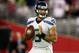 GLENDALE, AZ - OCTOBER 17: Quarterback Russell Wilson #3 of the Seattle Seahawks drops back to pass against the Arizona Cardinals during a game at the University of Phoenix Stadium on October 17, 2013 in Glendale, Arizona. (Photo by Christian Petersen/Getty Images)