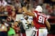 GLENDALE, AZ - OCTOBER 17: Quarterback Russell Wilson #3 of the Seattle Seahawks is pressured by outside linebacker Matt Shaughnessy #91 of the Arizona Cardinals during a game at the University of Phoenix Stadium on October 17, 2013 in Glendale, Arizona. (Photo by Christian Petersen/Getty Images)
