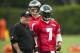 May 20, 2013; Philadelphia, PA, USA; Philadelphia Eagles head coach Chip Kelly talks with quarterback Michael Vick (7) during organized team activities at the NovaCare Complex. Mandatory Credit: Howard Smith-USA TODAY Sports