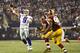 ARLINGTON, TX - OCTOBER 13: Tony Romo #9 of the Dallas Cowboys throws a pass under pressure against the Washington Redskins at AT&T Stadium on October 13, 2013 in Arlington, Texas. The Cowboys defeated the Redskins 31-16. (Photo by Wesley Hitt/Getty Images)