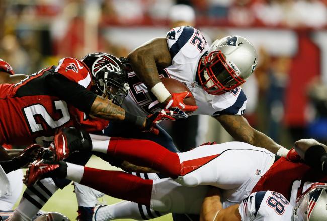 Hi-res-182451133-stevan-ridley-of-the-new-england-patriots-is-tackled-by_crop_north