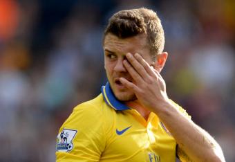 Hi-res-183436324-jack-wilshere-of-arsenal-looks-on-as-he-injures-his-eye_crop_north