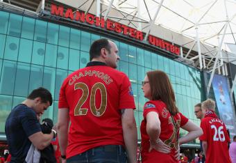Hi-res-177987162-manchester-united-fans-look-on-prior-to-the-barclays_crop_north