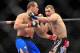 Dec 29, 2012; Las Vegas, NV, USA; Junior Dos Santos (left) and Cain Velasquez (right) exchange strikes during UFC 155 at the MGM Grand Garden Arena. Mandatory Credit: Gary A. Vasquez-USA TODAY Sports
