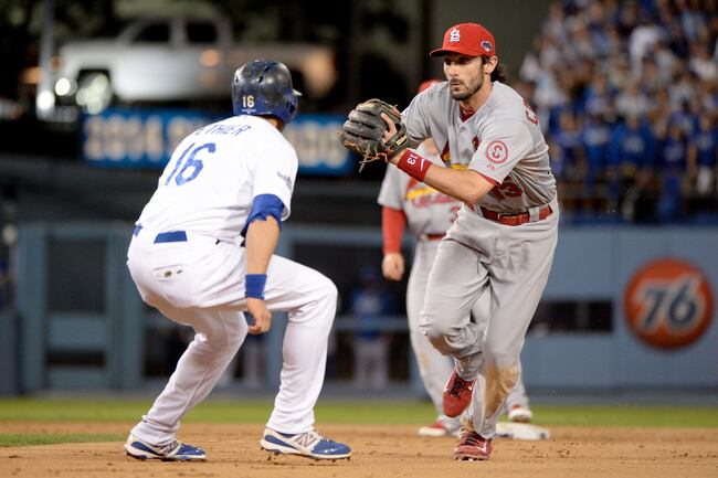 Hi-res-184724597-matt-carpenter-of-the-st-louis-cardinals-tags-out-andre_crop_north