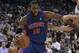 Mar 13, 2013; Oakland, CA, USA; Detroit Pistons center Greg Monroe (10) drives in against Golden State Warriors center Andrew Bogut (12) during the first quarter at Oracle Arena. Mandatory Credit: Kelley L Cox-USA TODAY Sports