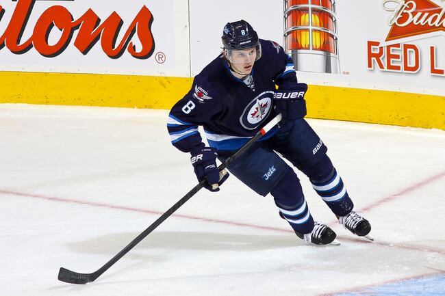 Hi-res-184774438-jacob-trouba-of-the-winnipeg-jets-keeps-an-eye-on-the_crop_north