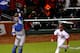 A.J. Ellis couldn't get a glove on Puig's overthrow in the third inning.