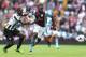 BIRMINGHAM, ENGLAND - SEPTEMBER 14: Christian Benteke of Aston Villa tangles with Mapou Yanga-Mbiwa of Newcastle United during the Barclays Premier League match between Aston Villa and Newcastle United at Villa Park on September 14, 2013 in Birmingham, England. (Photo by Mark Thompson/Getty Images)