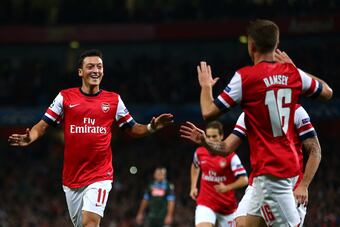 Hi-res-182601461-mesut-oezil-arsenal-is-congratulated-by-teammate-aaron_crop_north