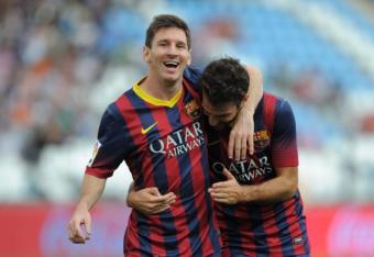 182582134-lionel-messi-celebrates-with-cesc-fabregas-after_crop_north