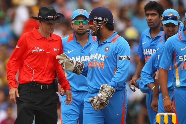 Hi-res-139930576-dhoni-of-india-talks-to-umpire-billy-bowden-about-a_crop_north