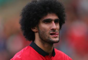 Hi-res-182110307-marouane-fellaini-of-manchester-united-looks-dejected_crop_north