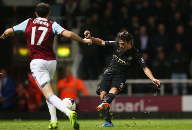 Hi-res-185352279-david-silva-of-manchester-city-scores-his-teams-third_crop_north