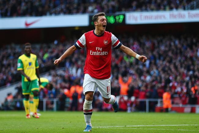 Hi-res-185350282-mesut-oezil-of-arsenal-celebrates-as-he-scores-their_crop_north